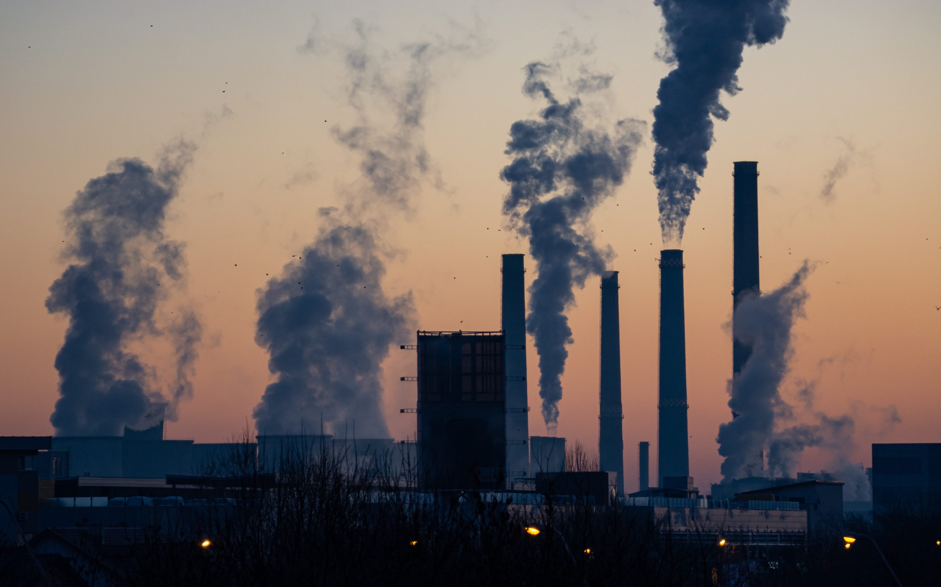 Photo of factory polluting air by Ella Ivanescu on Unsplash